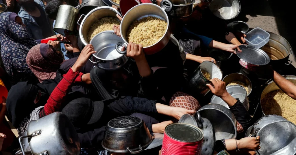 Palestinians Gather to Receive Food from Charity Organization