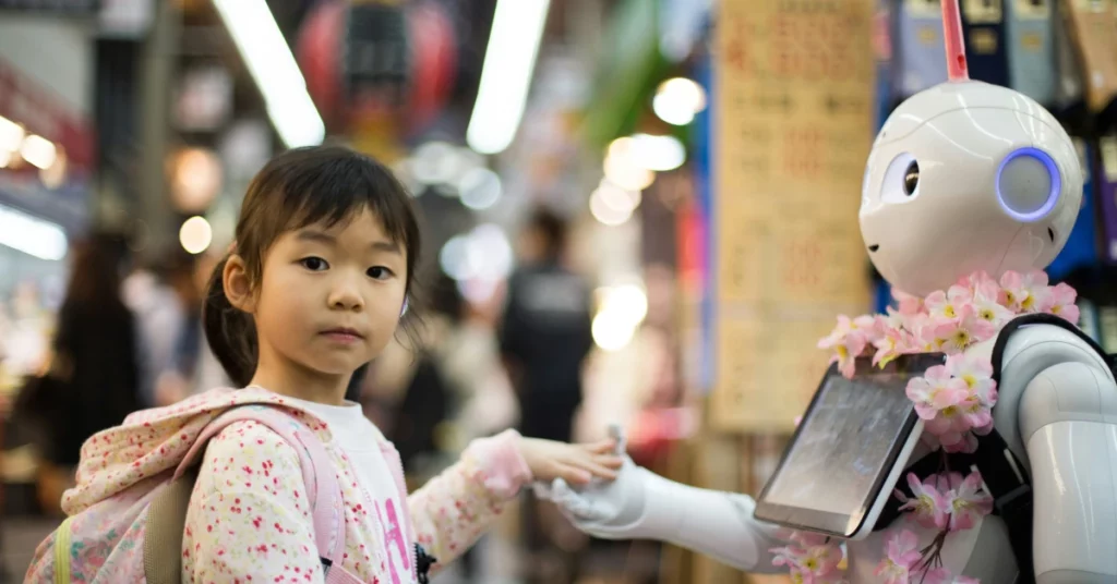 As Kuromon Market in Osaka was about to close for the evening I sampled some delicious king crab and did a final lap of the market when I stumbled upon one of the most Japanese scenes I could possibly imagine, a little girl, making friends with a robot.